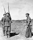 Korea: A North Korean military policeman with two North Korean soldiers near the 37th parallel, 1951