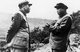 Korea / China: Peng Dehuai (left), Commander in Chief Chinese People's Volunteer Army in Korea, discusses strategy with North Korean leader Kim Il-sung somewhere in North Korea, c. 1951